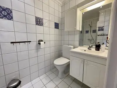 a bathroom with a toilet and a sink and a mirror at Perfect For Skiing And City Access in Beitostøl
