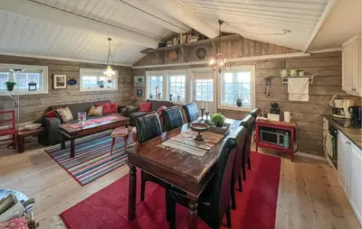 a living room with a table and a couch at Lovely Home In Beitostølen in Beitostøl