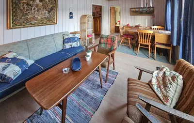 a living room with a couch and a table at 2 Bedroom Awesome Home In Vikersund in Vikersund
