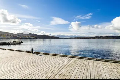 a dock on a large body of water at Leilighet i Sandviken in Bergen