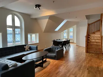 a living room with a couch and a table at Vetrlidsallmenningen 4 in Bergen