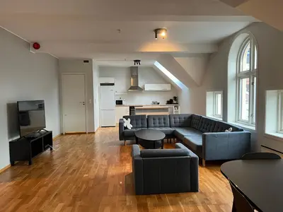 a living room with a couch and a table at Vetrlidsallmenningen 4 in Bergen