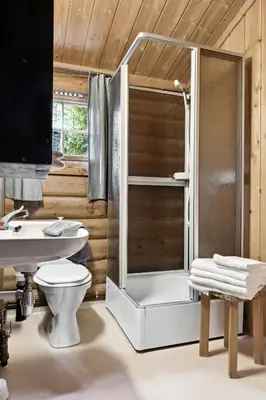 a bathroom with a shower and a toilet and a sink at Cabin With Panoramic Views Over Trysil in Trysil