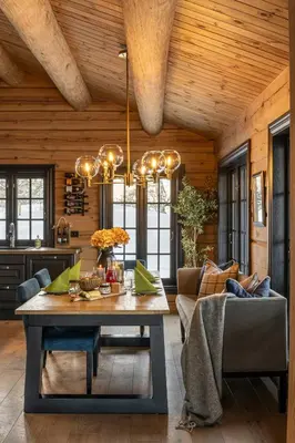 a dining room with a table and a chandelier at Modern Log Cabin With Hot Tub And Sauna in Veggli