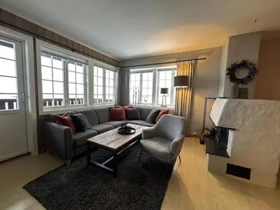 a living room with a couch and a table at Modern 2-Bedroom Apartment In Ideal Location in Beitostøl