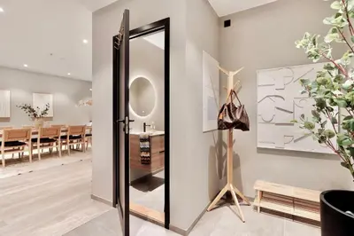 a mirror in a room with a dining room at Luxurious Villa in the heart of Bergen with private parking in Bergen