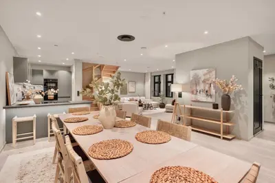 a dining room and living room with a table and chairs at Luxurious Villa in the heart of Bergen with private parking in Bergen