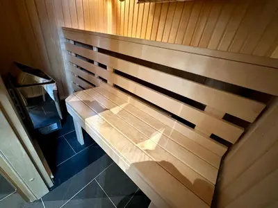 a wooden bench sitting in a sauna at Cozy Cabin With Ski Trail Access in Beitostøl