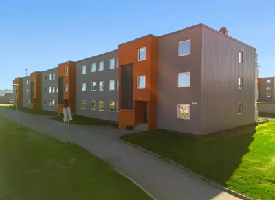 a rendering of a row of apartment buildings at Lys og koselig leilighet leies ut til Ski VM 2025 in Trondheim