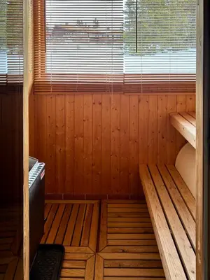 an empty wooden sauna with a window in it at Apartment at Hafjell by Gaia ski-in out in Hafjell