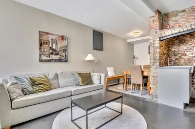 a living room with a couch and a table at Bryggen Nest in Bergen
