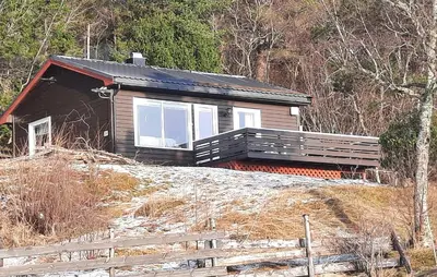 a small house sitting on top of a snow covered hill at Stunning Home In Øydegard in Nastad