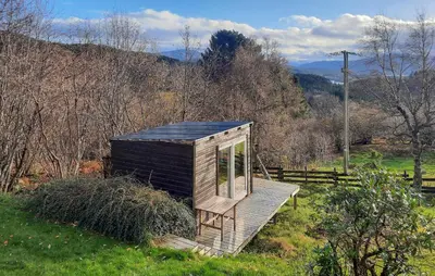 a small wooden cabin in a field of grass at Stunning Home In Øydegard in Nastad