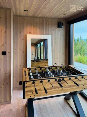 a large wooden foosball table in a room at New modern cabin at Norefjell with sauna in Noresund