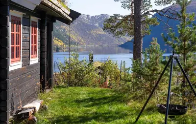 a picture of a house with a view of a lake at Amazing Home In Hovet With Sauna in Hovet