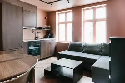 a living room with a couch and a table at New Apartment in Historical street in Bergen