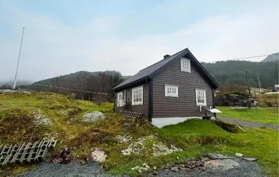 a small house sitting on top of a hill at 1 Bedroom Beautiful Home In Korssund in Korssund