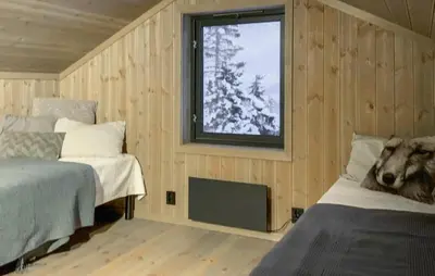 a bedroom with two beds and a window at Stunning Home In Flå With Sauna in Skadeland