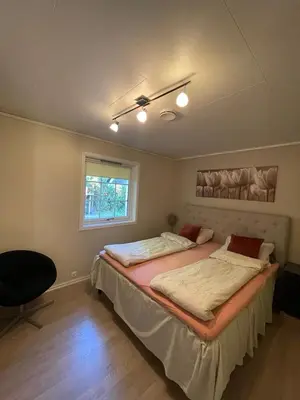 a bedroom with two beds and a window at Villa 10 min walk from Ski World Championship in Trondheim