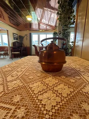 a tea pot sitting on top of a table at Sognefjord Gjesteheim in Vangsnes
