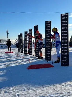 a group of skiers standing in front of signs in the snow at Perfect Base For Skiing And Local Events in Beitostøl