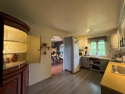 a kitchen with a counter and a dining room at Mountain Home With 5 Bedrooms And 2 Fireplaces in Beitostøl