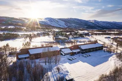 an aerial view of a ski resort in the snow at Geilo sentrumsnær leilighet in Geilo