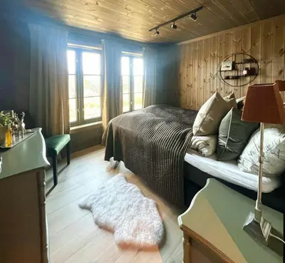 a bedroom with a bed and a rug at Family Cabin With Ski-Inski-Out In Trysil in Trysil