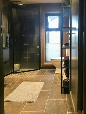 a bathroom with a shower and a toilet at Large Cabin Near Hardangervidda With Sunny Veranda in Veggli