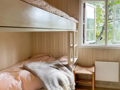 a bedroom with a bed and a window at Cosy Holiday Home With Stunning Views In Rauland in Rauland