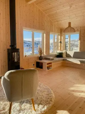 a living room with a couch and a chair at Cosy Holiday Home With Stunning Views In Rauland in Rauland
