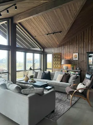 a living room with a couch and a table at Modern Cabin With Views Of Skeikampen in Svingvoll