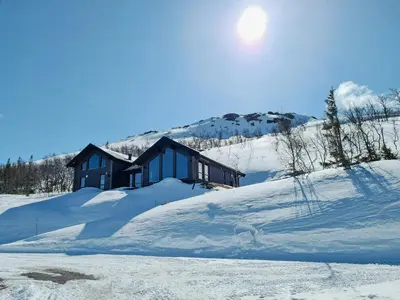 a house on top of a snow covered mountain at Luxury Mountain Home With View On Gaustablikk in Rjukan