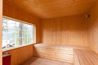 a room with a sauna with a window at Cozy Cabin In Uvdal With Jacuzzi And Sauna in Uvdal