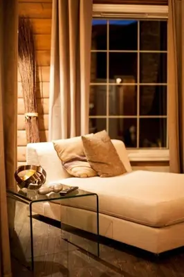 a living room with a white couch and a glass table at Cozy Cabin In Uvdal With Jacuzzi And Sauna in Uvdal