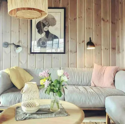a living room with a couch and a table with flowers at Secluded Mountain Cabin In Rauland With View in Brunstad