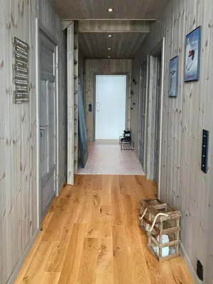 a hallway of a house with a wooden floor at Modern Cabin In Trysil With Mountain Views in Trysil