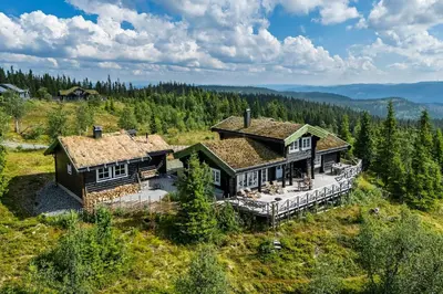 an aerial view of a house in the mountains at Cozy And Spacious Family Cabin In Valdres in Bagn