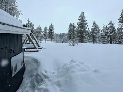 a pile of snow on the side of a house at Cabin With Mountain View Near Lake Totak in Rauland