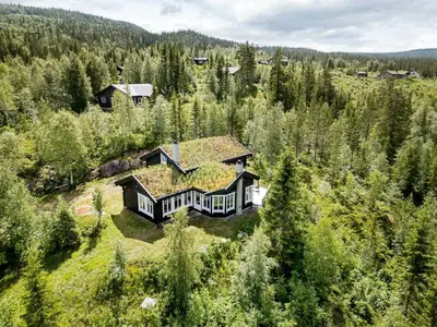 an aerial view of a house in the woods at Family Cabin With Panoramic View Near Vikerfjellet in Hønefoss