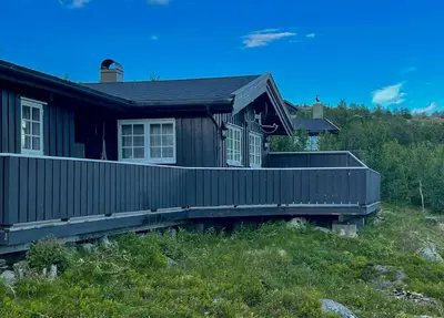 a house on a hill with a deck at Cabin In Uvdal With A View Ski-Inout in Uvdal