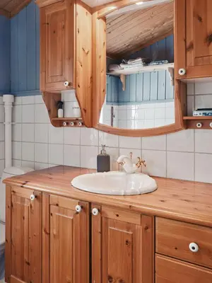 a bathroom with a sink and wooden cabinets at Cabin In Uvdal With A View Ski-Inout in Uvdal