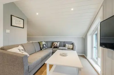 a living room with a couch and a table at High-Standard Cabin In Beautiful Rauland in Rauland