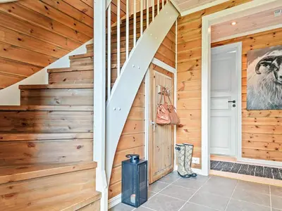 a staircase in a house with wooden walls at 9 person holiday home in Rauland in Rauland