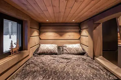 a large bed in a room with a window at Cabin With Great Fishing At Trysilfjellet in Jordet