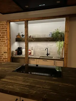 a kitchen with a sink and a window at Cabin with large outdoor area in Hamar
