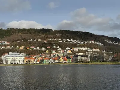 a town on a hill next to a body of water at Lake view apartment in center of Bergen - 3 bedrooms in Bergen