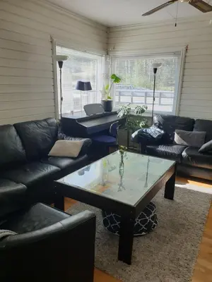a living room with couches and a coffee table at Holiday Home Villa Gol in Gol