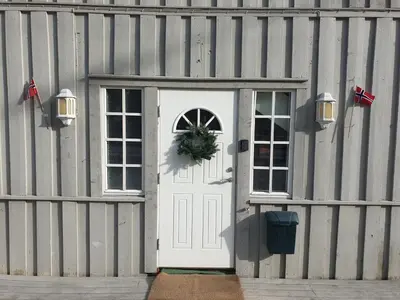 a white door with a wreath on it on a building at Holiday Home Villa Gol in Gol