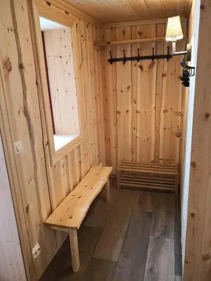 a wooden sauna with a bench in a room at Cozy cabin centrally located in Hovden in Hovden